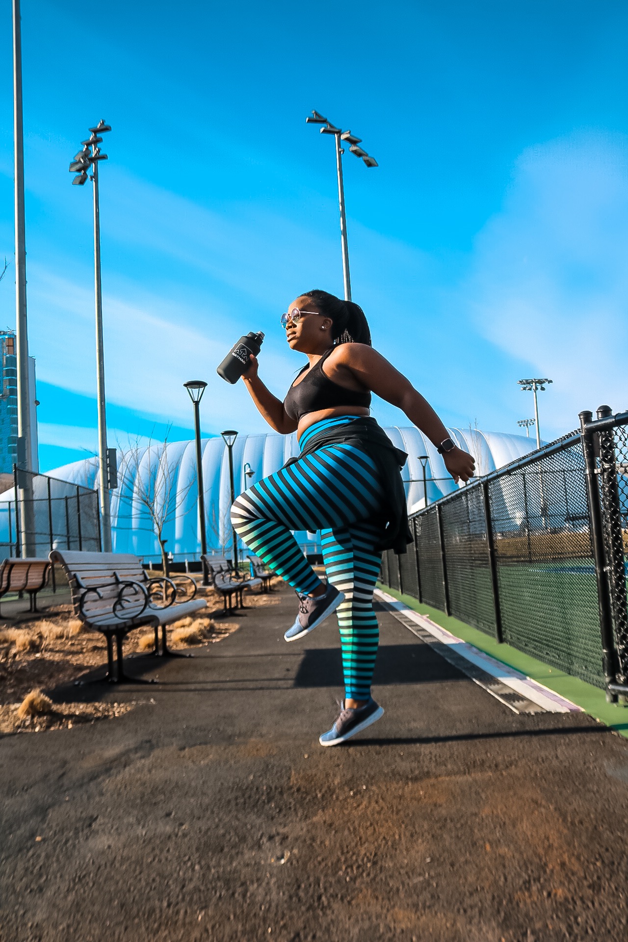 African and Boston blogger Binja wearing Danskin workout pants and Hind workout top #Africancocktail