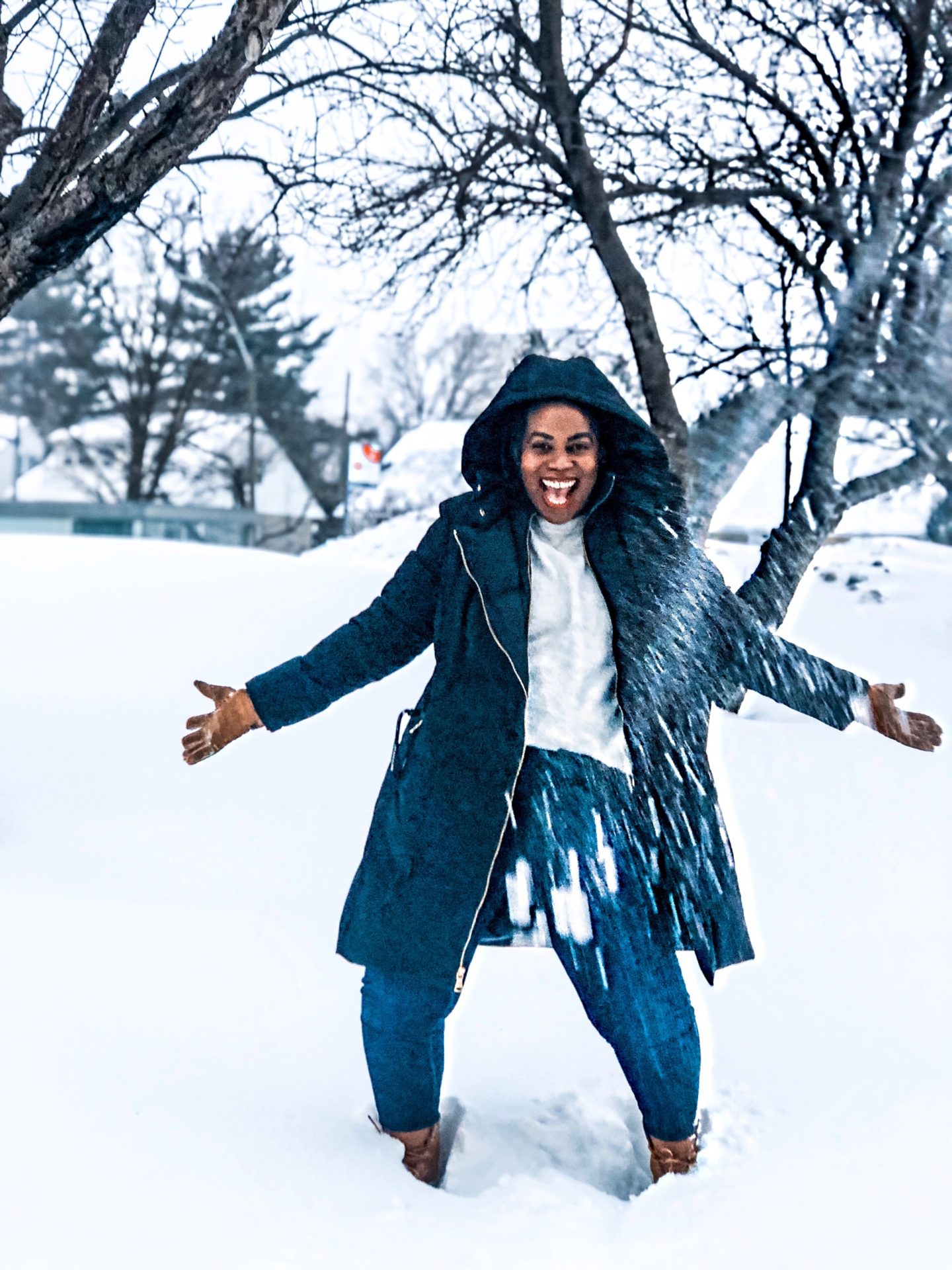 African blogger based in Boston Binja the Africancocktail playing in the snow in Ottawa Canada