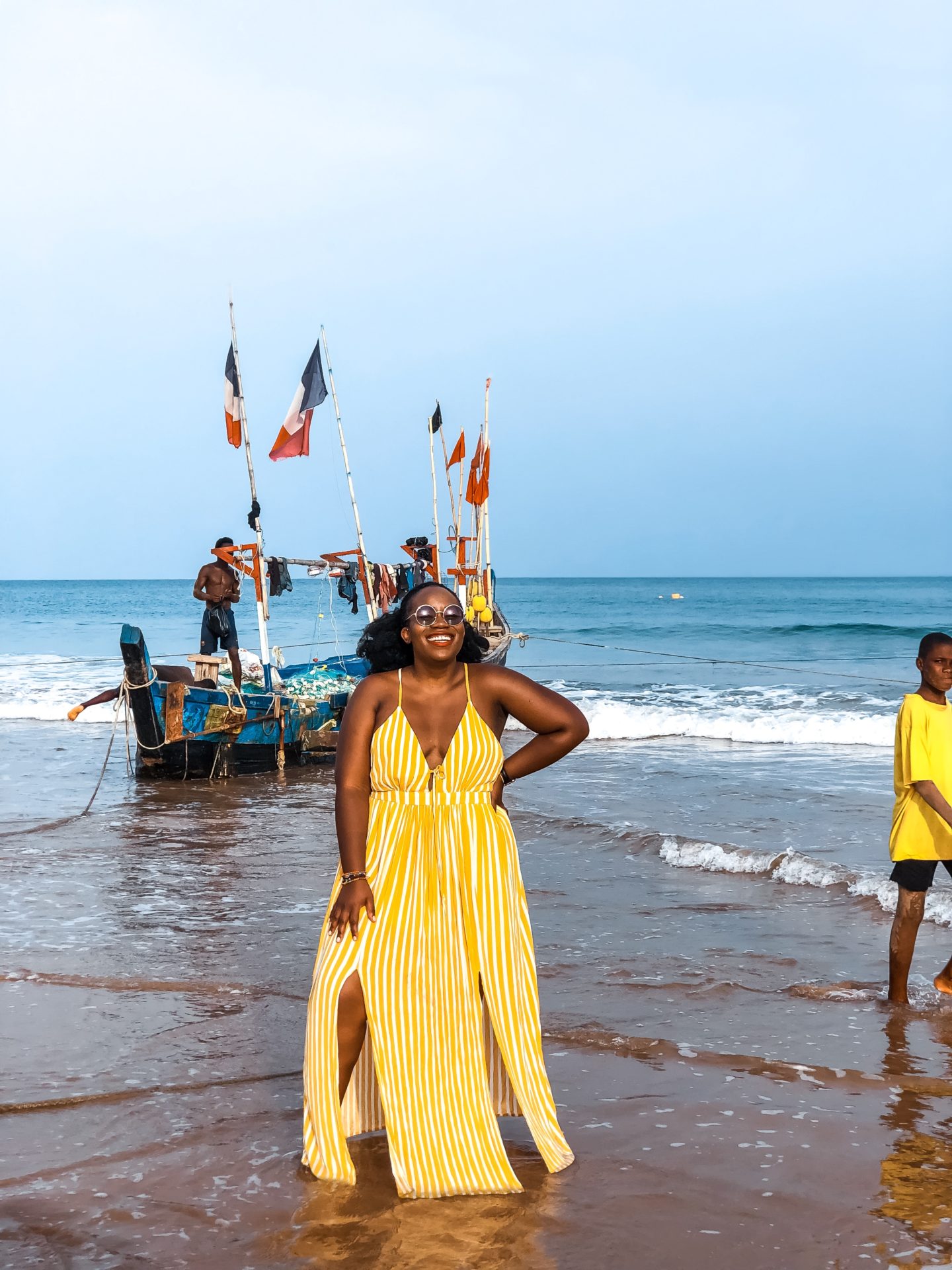Boston based African blogger Binja, the Africancocktail, is wearing a yellow maxi dress from Charlotte Russe. Africancocktail is in Busua, Ghana.