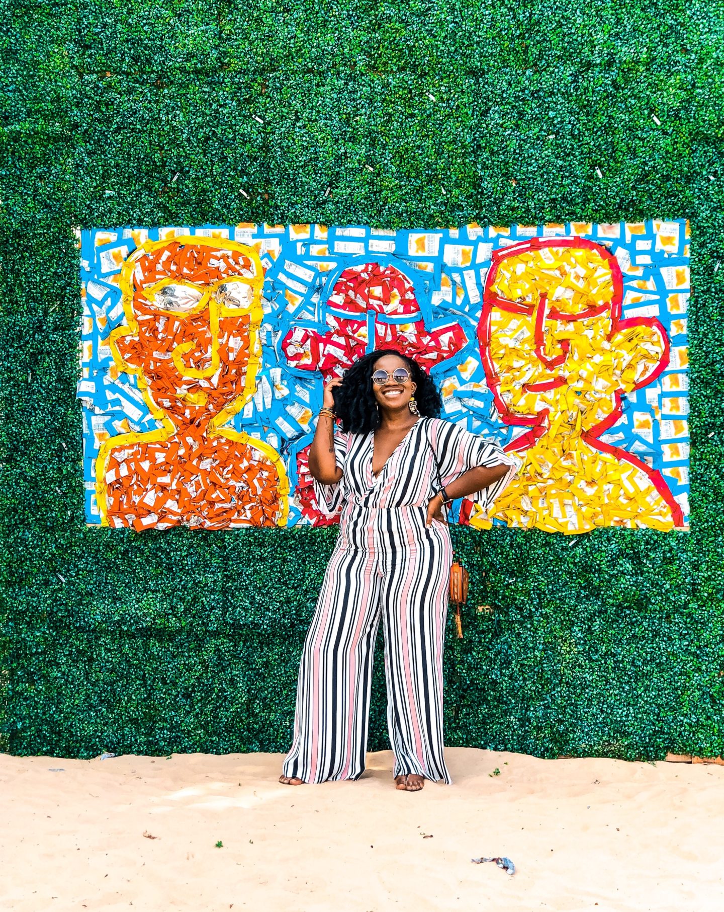 Boston based African blogger Binja, the Africancocktail, is wearing a stripped jumpsuit from Charlotte Russe. Africancocktail is in Busua, Ghana.