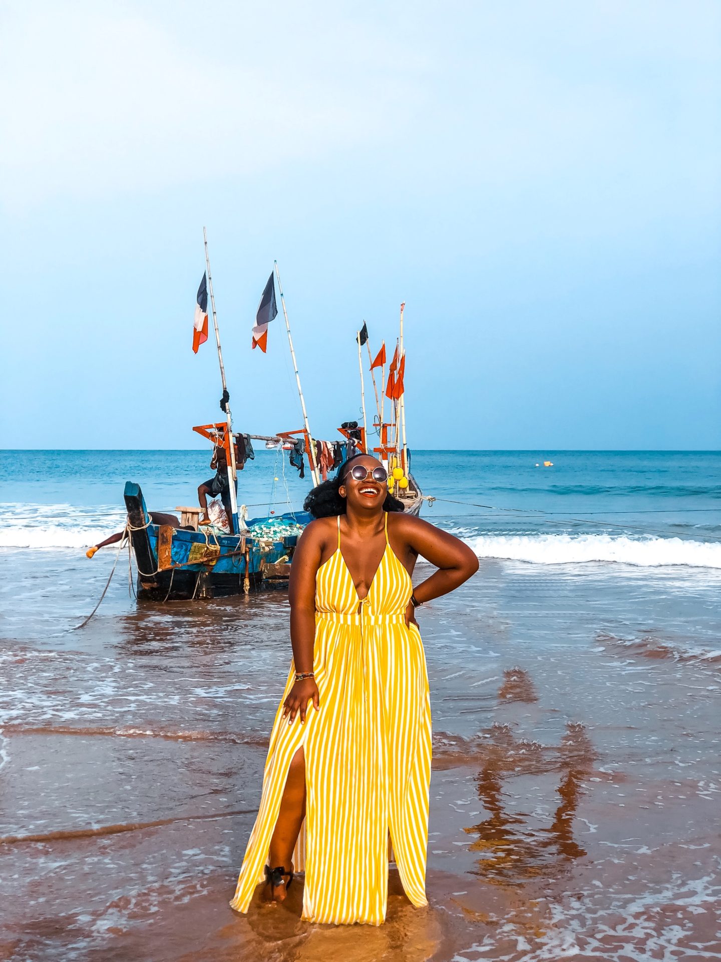 Boston based African blogger Binja, the Africancocktail, is wearing a yellow maxi dress from Charlotte Russe. Africancocktail is in Busua, Ghana.